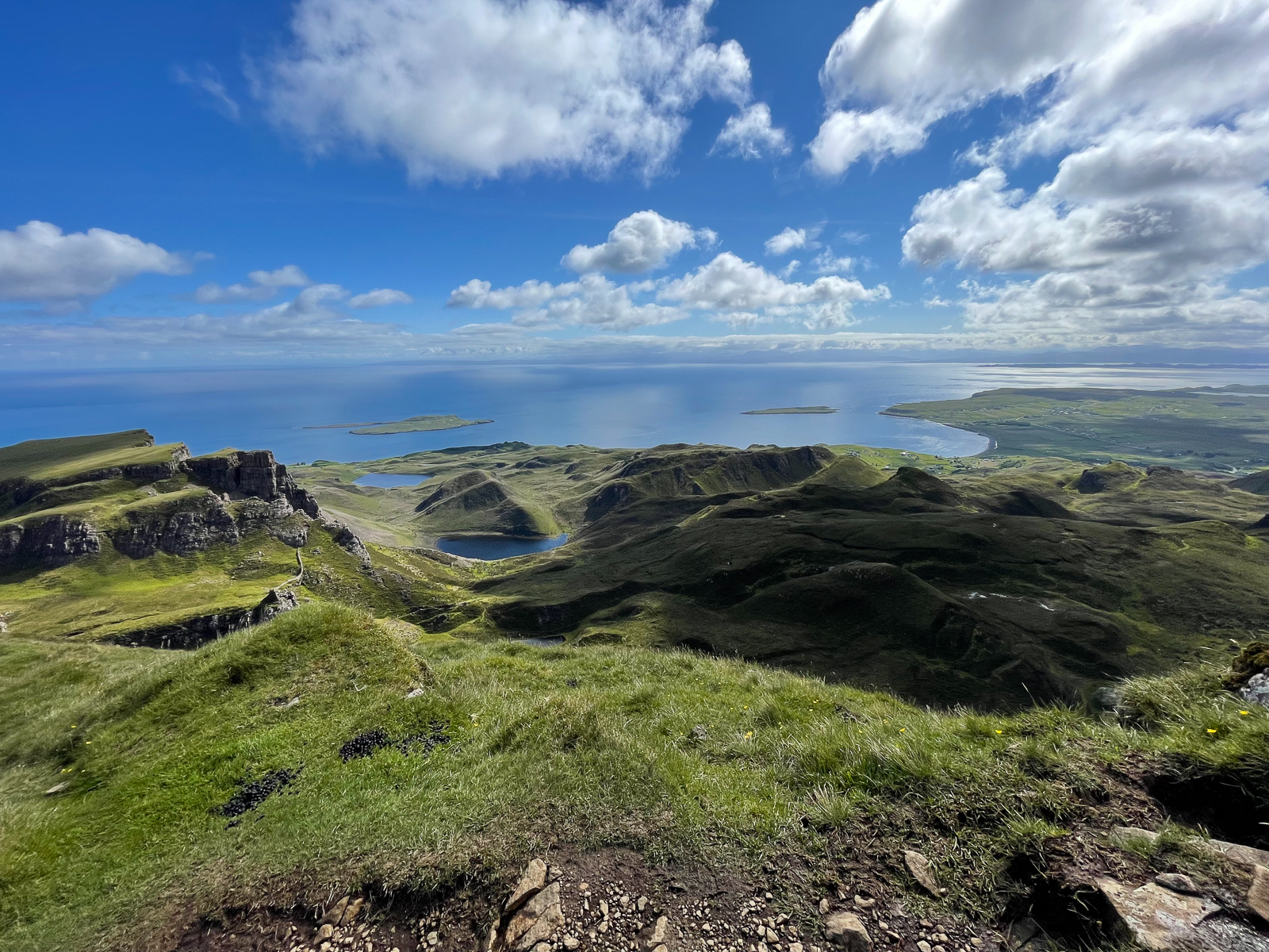 View of the hills, sky, and sea from a hike on the Quiraing on the Isle of Skye.