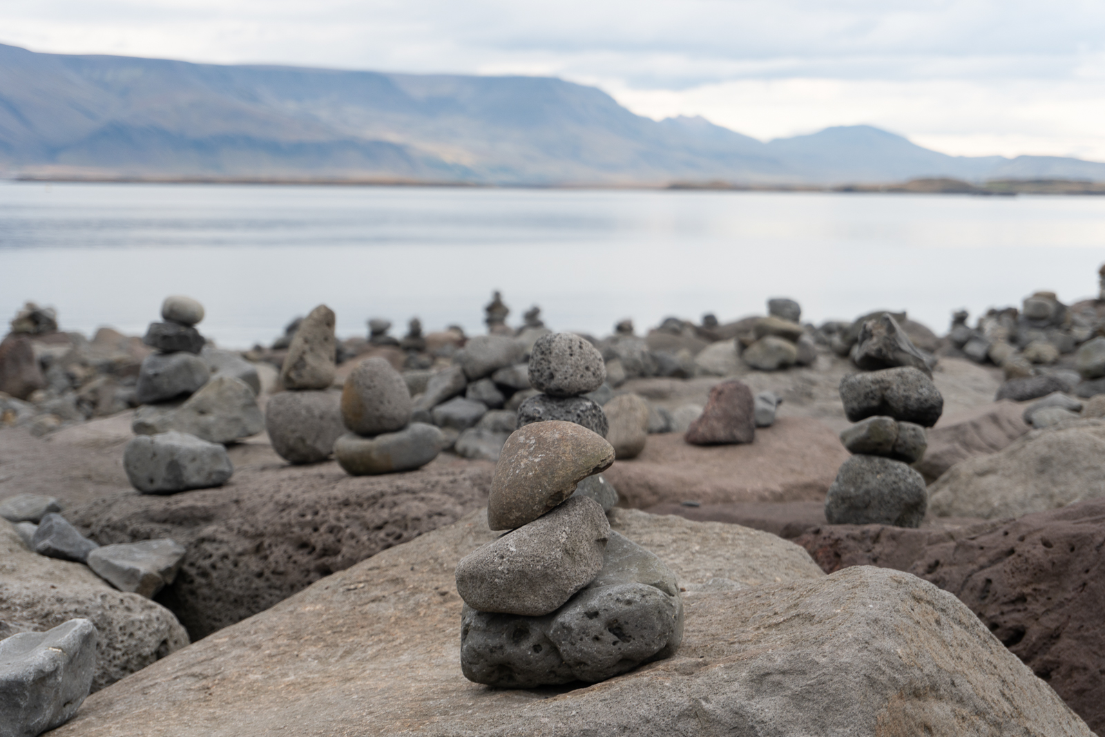 Rock cairns near the water in Reykjavík, Iceland.